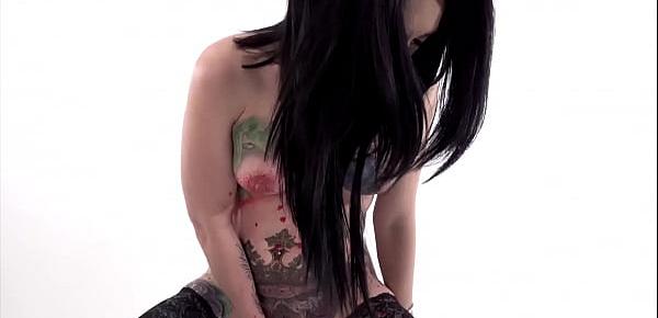 Tattooed babe Marie Bossette covers herself in hot wax